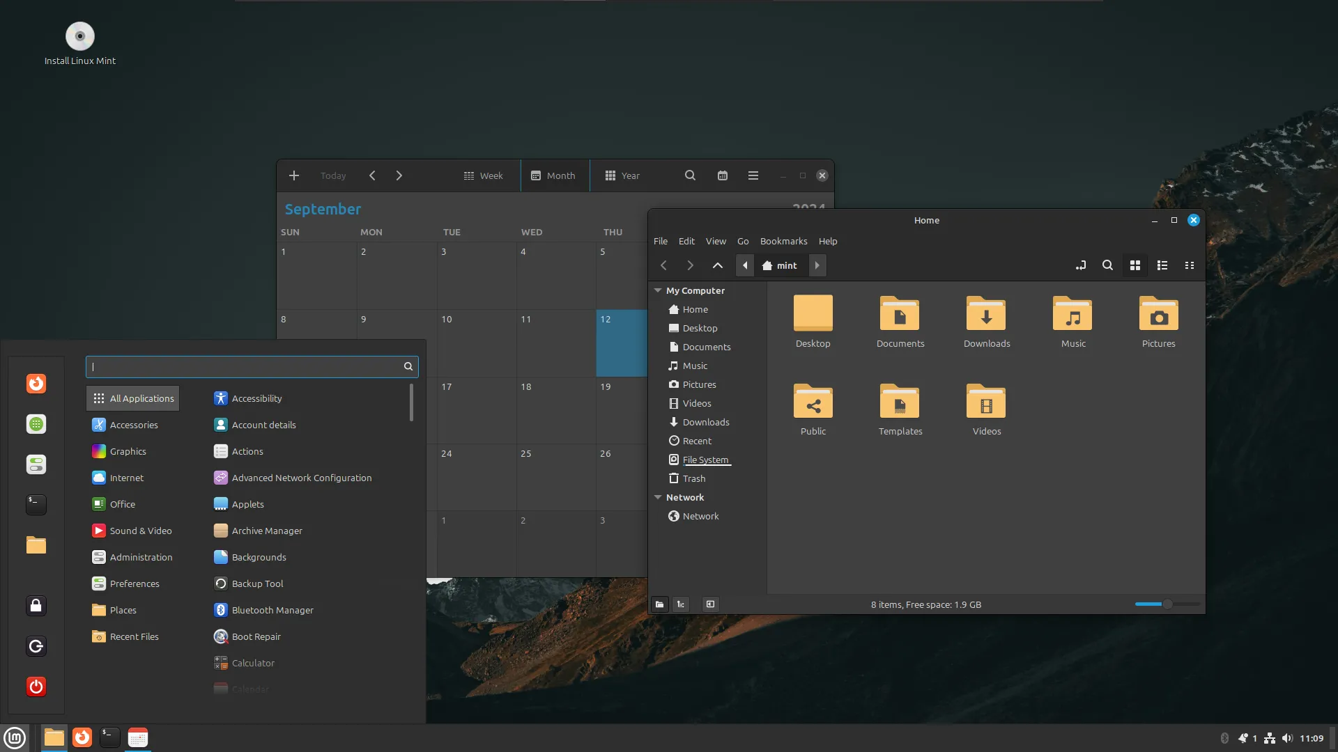 Giao diện desktop của hệ điều hành Linux Mint với ứng dụng lịch và trình duyệt tệp đang mở, thể hiện môi trường làm việc di động